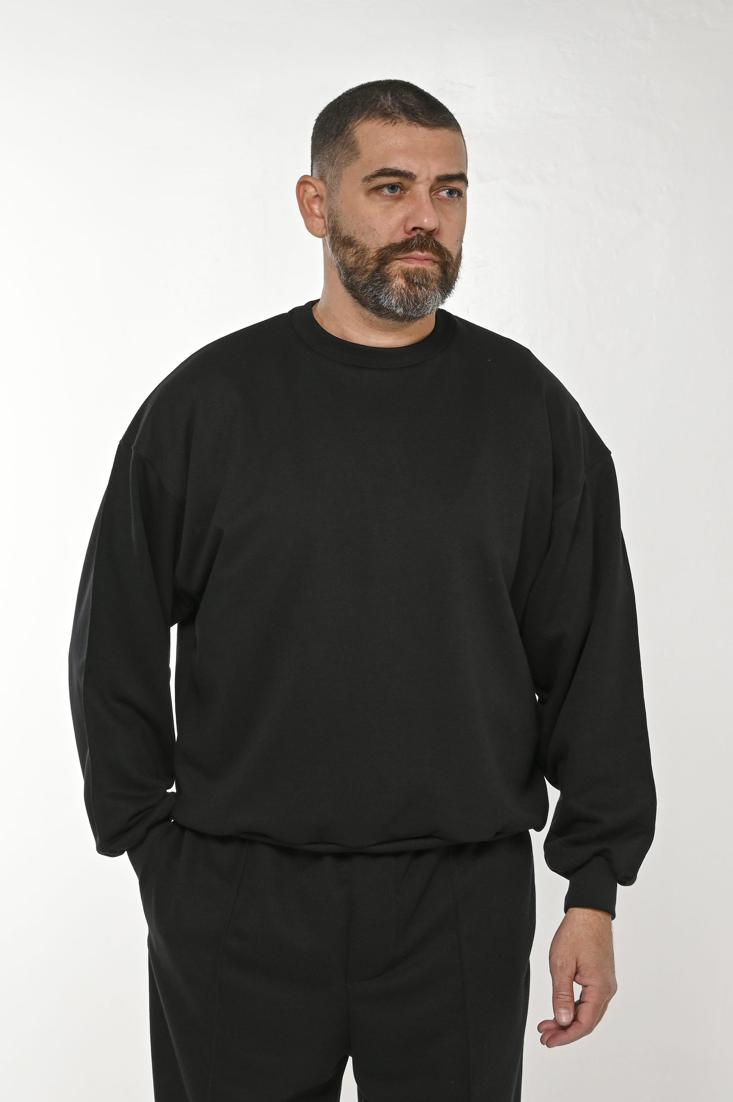 Gente Guapa black hoodie with “11:11 Everything will come to you at the perfect time” print — unisex streetwear front view