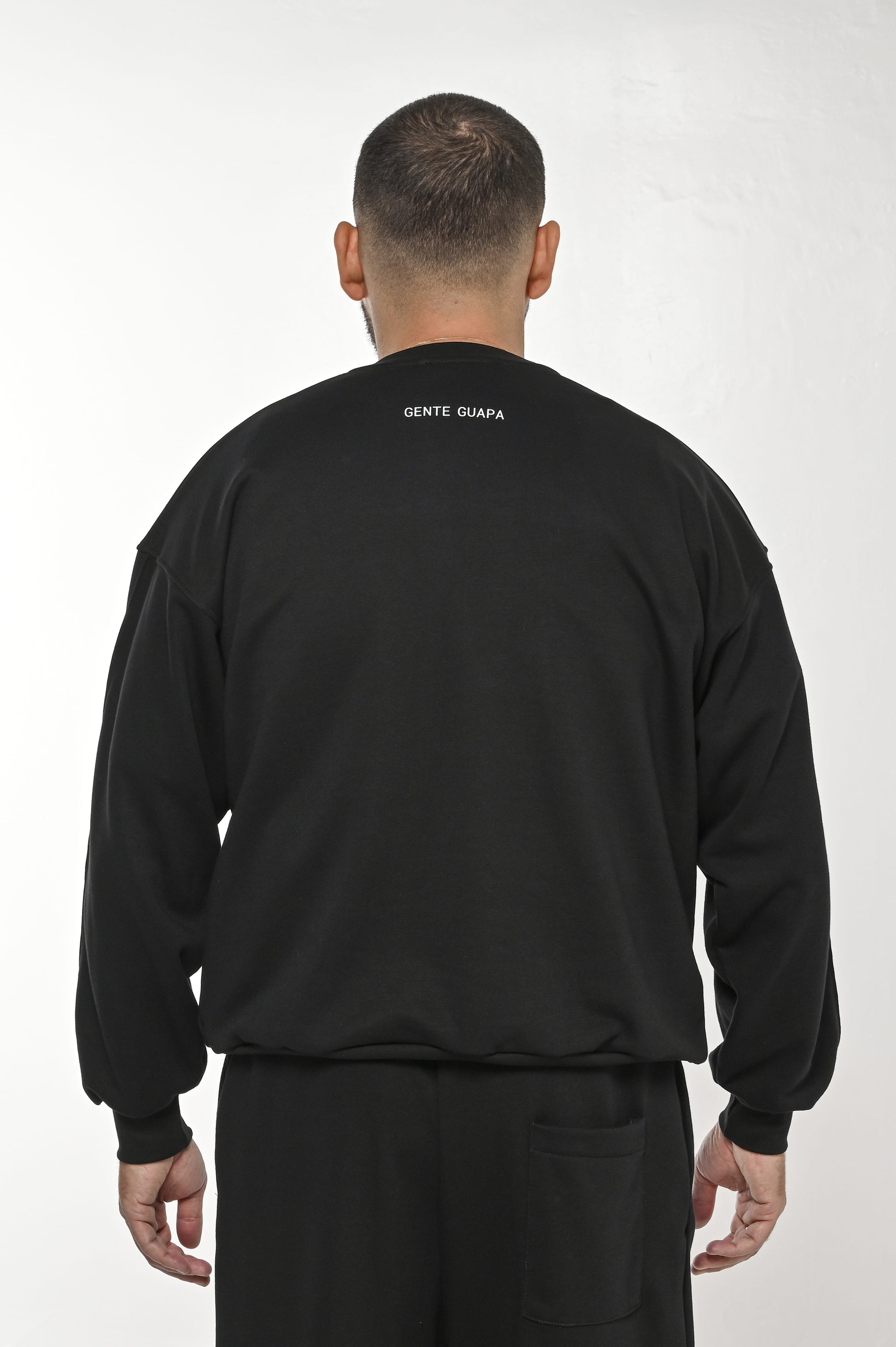 Gente Guapa black hoodie with “I AM ALLERGIC TO FAKE PEOPLE” print – unisex streetwear back view