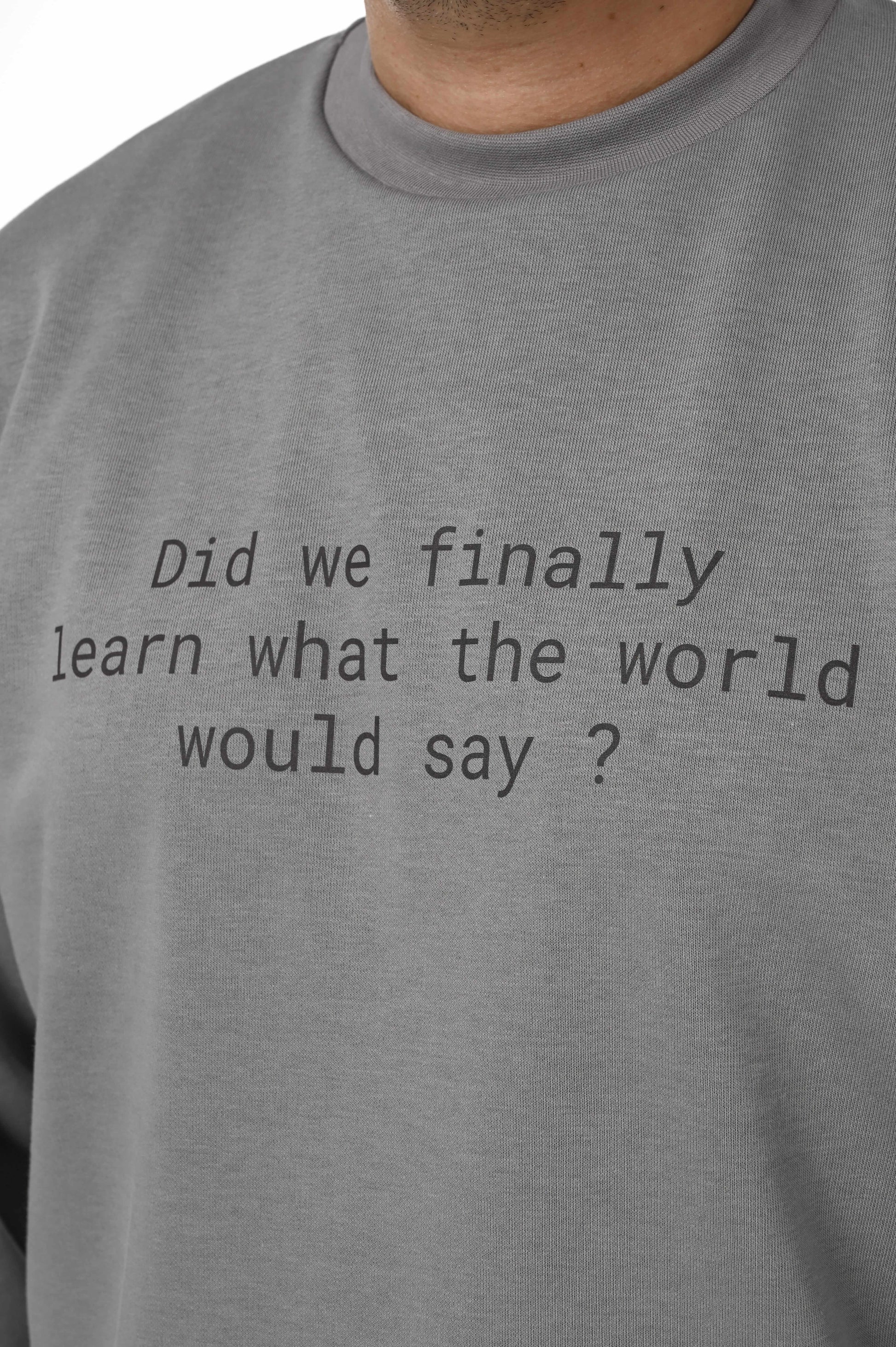 Gente Guapa black hoodie with “Did we finally learned what world would say” quote — unisex streetwear detail view